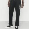 Cheap 🔥 Hollister Co. TONAL TECH LOGO - Tracksuit Bottoms - Black 😉